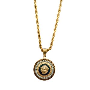 Collana con pendente modello Medusa in acciaio dorato